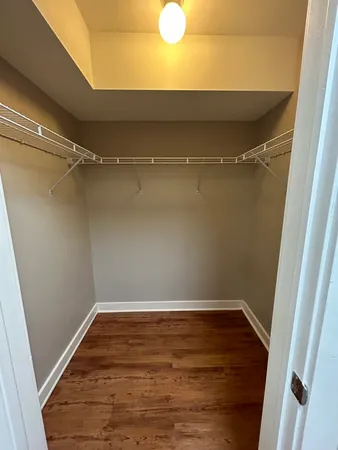 a view of room with wooden floor