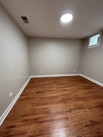 a view of wooden floor in an empty room
