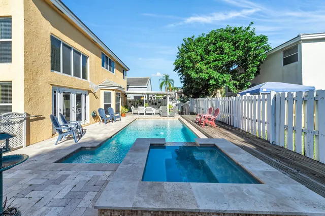 a view of a backyard with sitting area