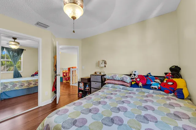 a bedroom with a bed and a couch