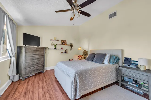 a bathroom with a tub a sink and a window
