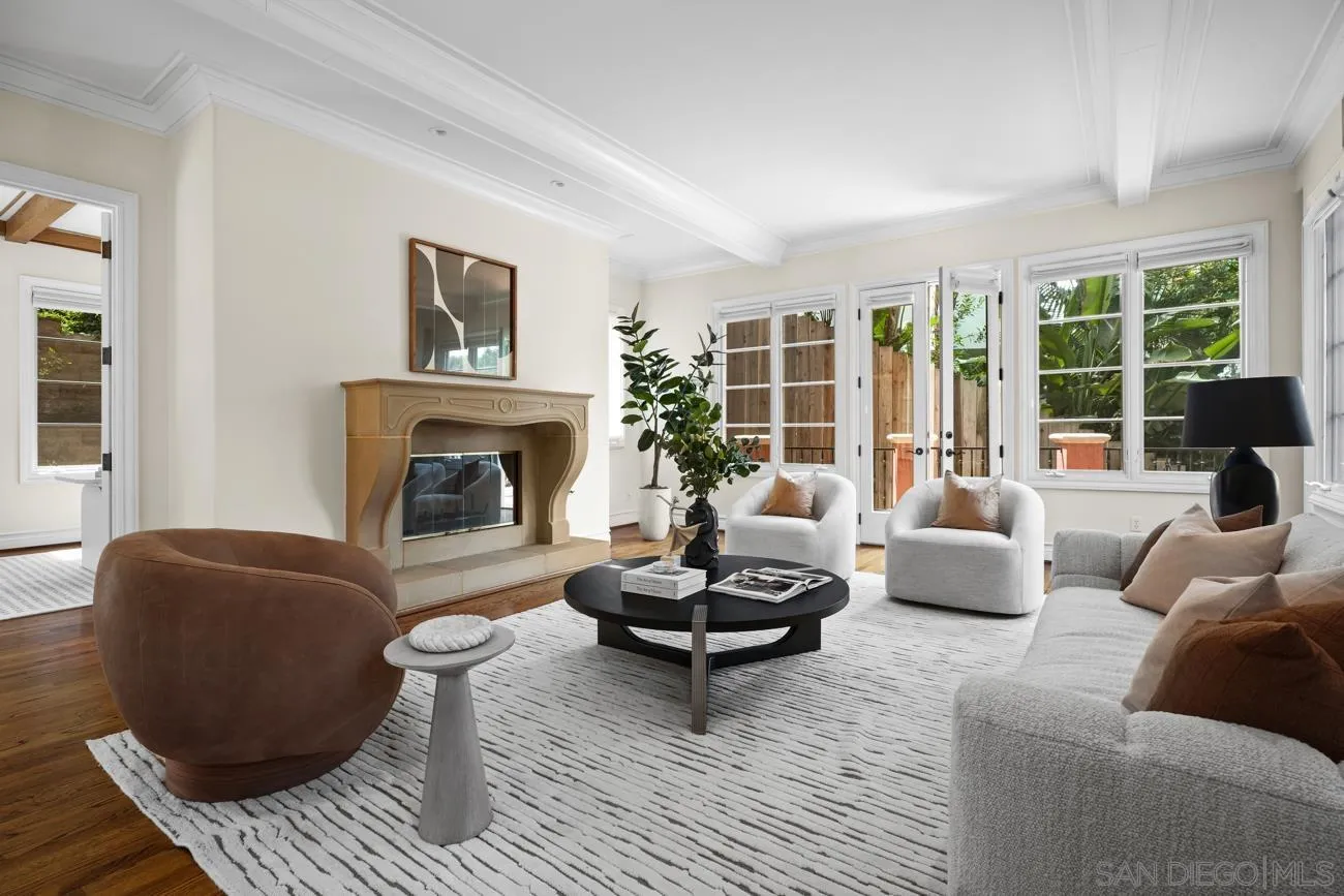 1631 Mimulus Way La Jolla, CA 92037 - Photo 14 of 33 a living room with furniture a fireplace and a large window