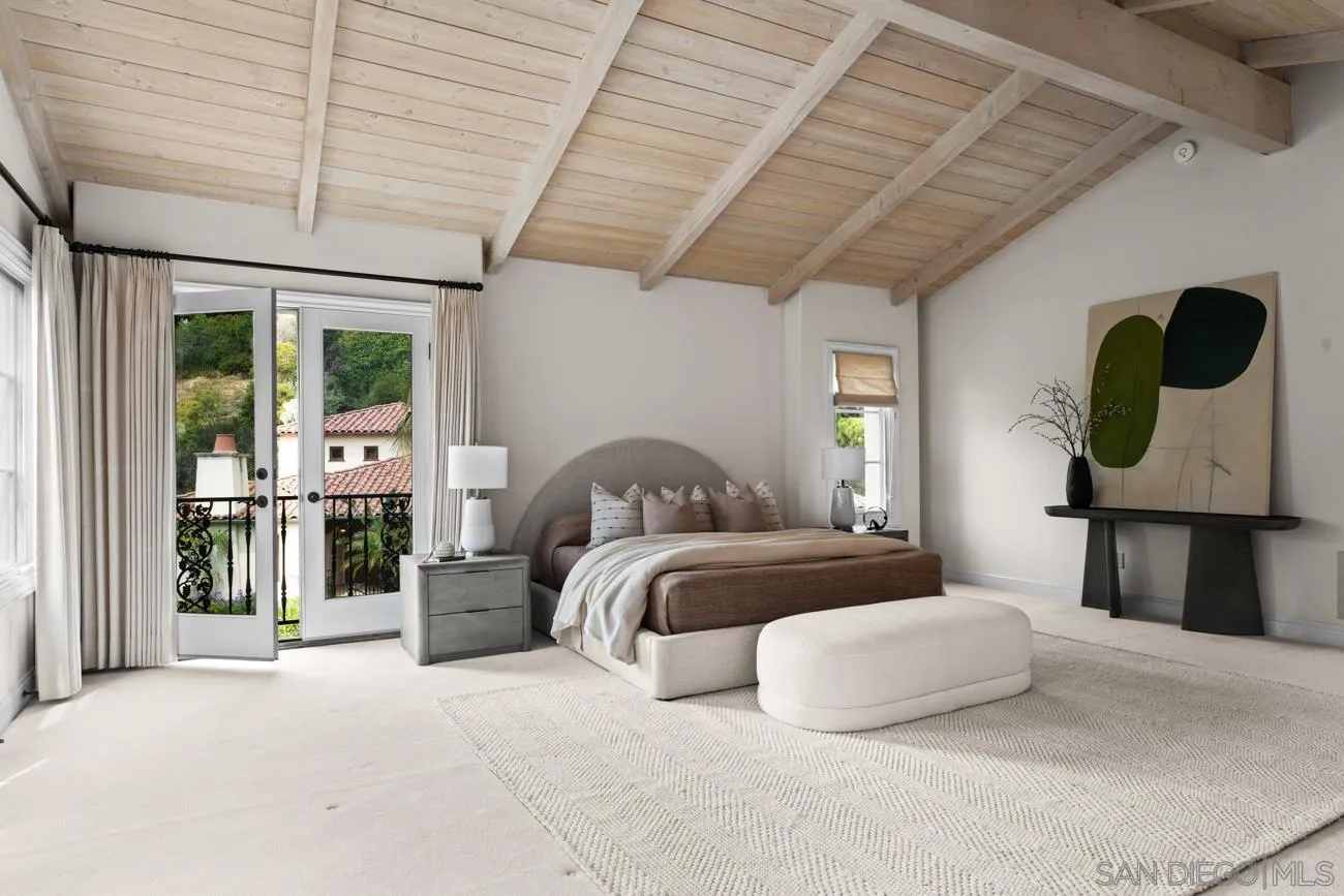 1631 Mimulus Way La Jolla, CA 92037 - Photo 22 of 33 a bedroom with a large bed and a large window