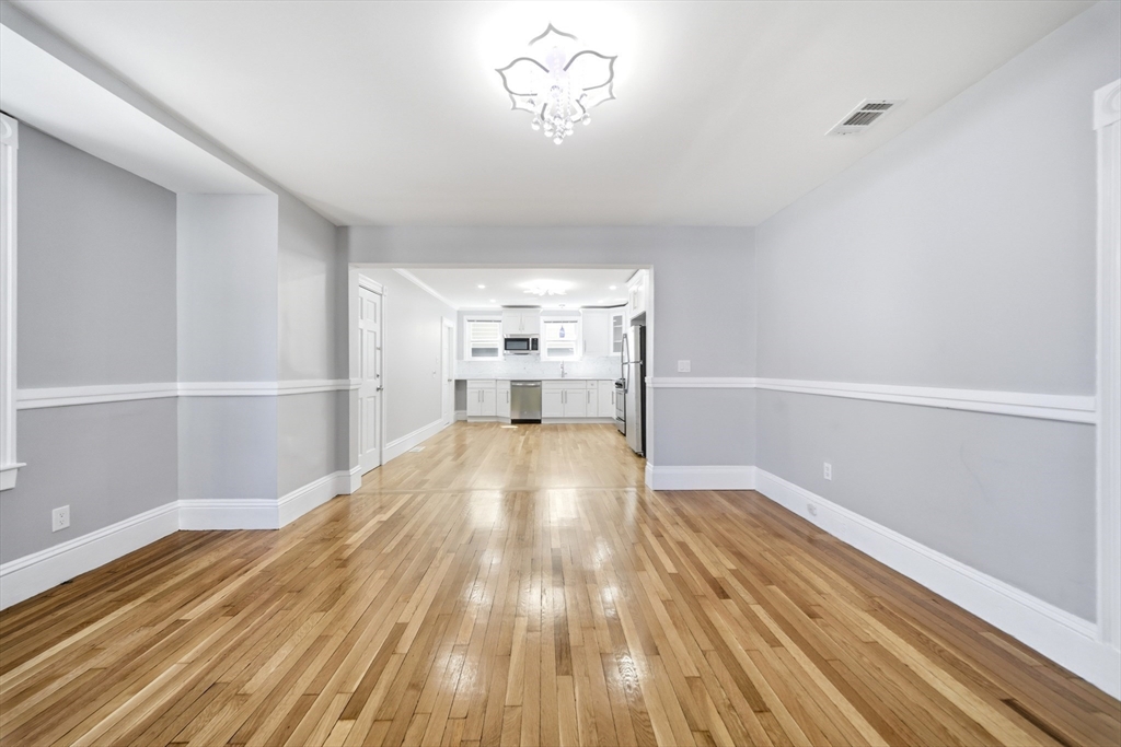 29 Hanson Street, Unit 1 Somerville, MA 02143 - Photo 15 of 40 a view of empty room with wooden floor