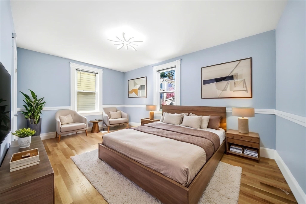29 Hanson Street, Unit 1 Somerville, MA 02143 - Photo 24 of 40 a spacious bedroom with two beds and potted plant