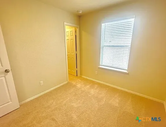a bathroom with a toilet and a bathtub