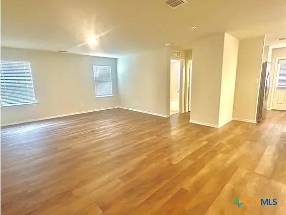 a view of kitchen and wooden floor