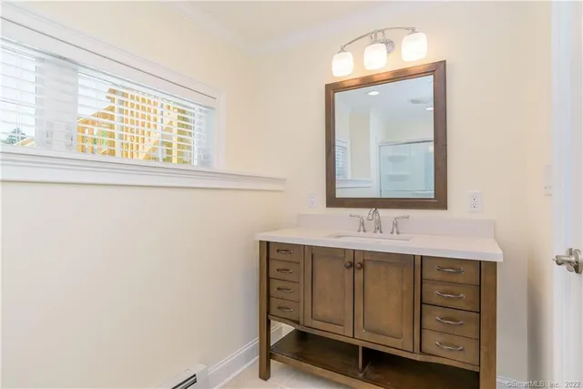 a bathroom with a sink a vanity and a mirror