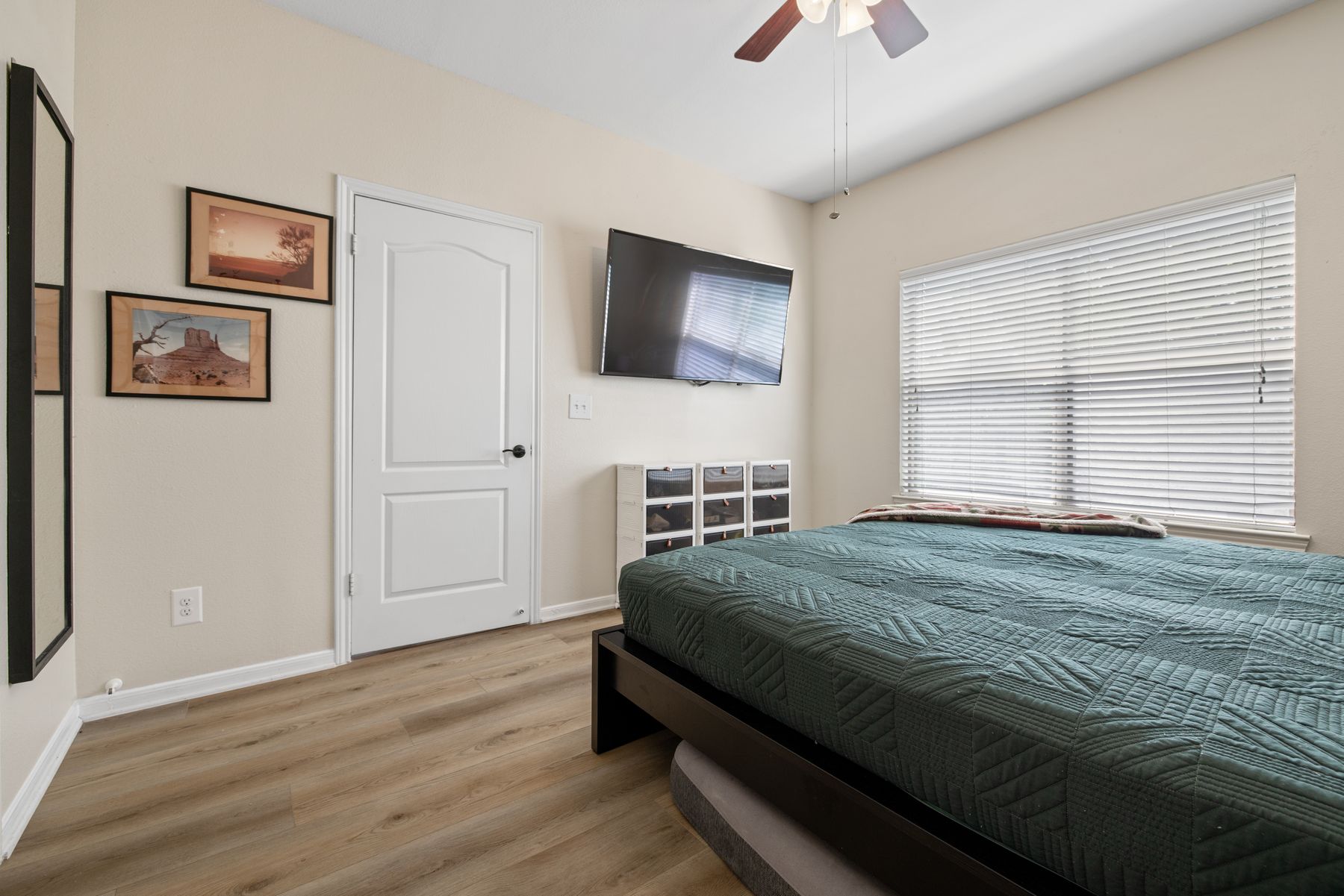 6000 Shepherd Mountain Cove, Unit 302 Austin, TX 78730 - Photo 15 of 22 a bedroom with a bed and a chandelier