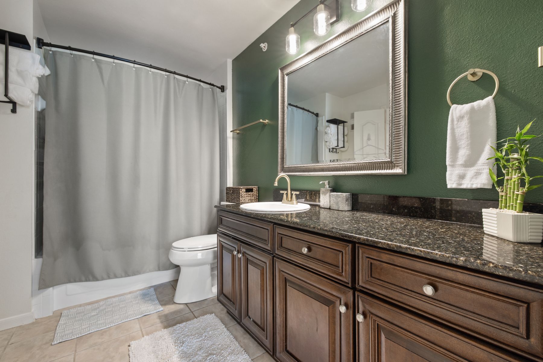 6000 Shepherd Mountain Cove, Unit 302 Austin, TX 78730 - Photo 18 of 22 a bathroom with a granite countertop sink and a mirror