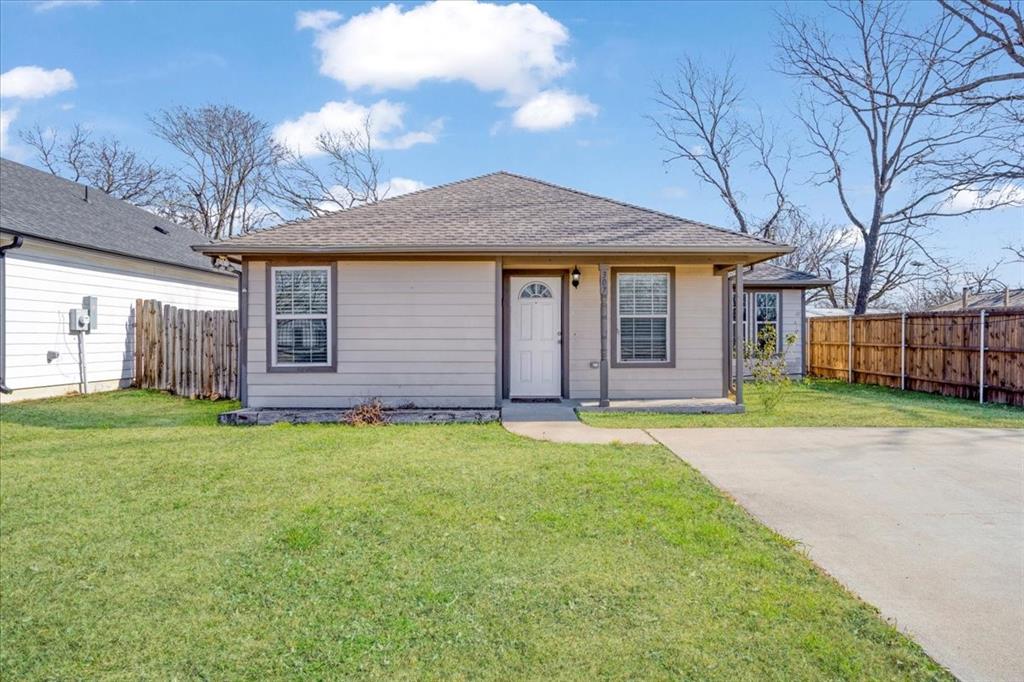 307 North Carter Street Howe, TX 75459 - Photo 11 of 31 a front view of a house with a garden and yard