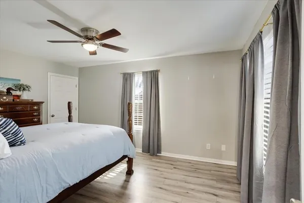 a bedroom with a bed and a mirror