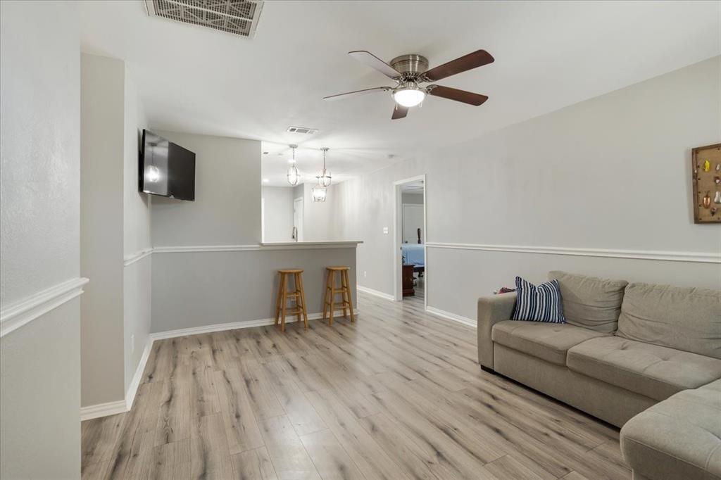 307 North Carter Street Howe, TX 75459 - Photo 12 of 31 a living room with furniture and a wooden floor