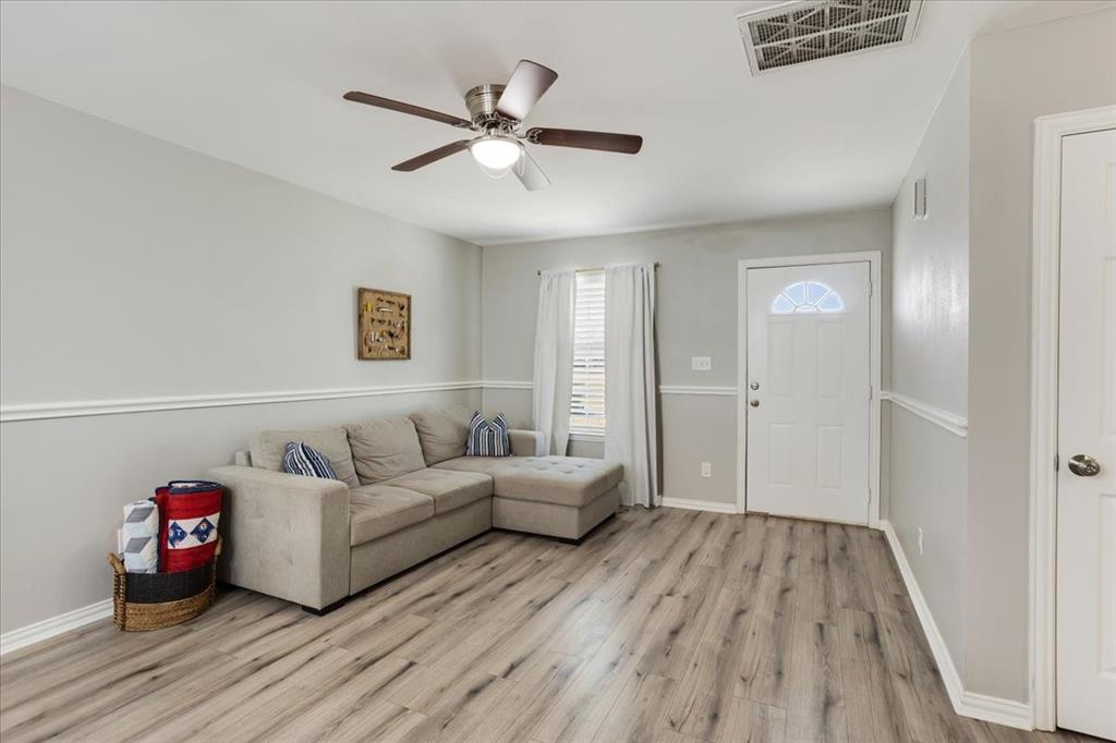 307 North Carter Street Howe, TX 75459 - Photo 13 of 31 a living room with furniture and a wooden floor