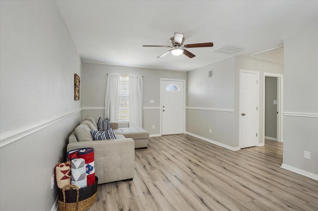 307 North Carter Street Howe, TX 75459 - Photo 14 of 31 a living room with furniture and wooden floor
