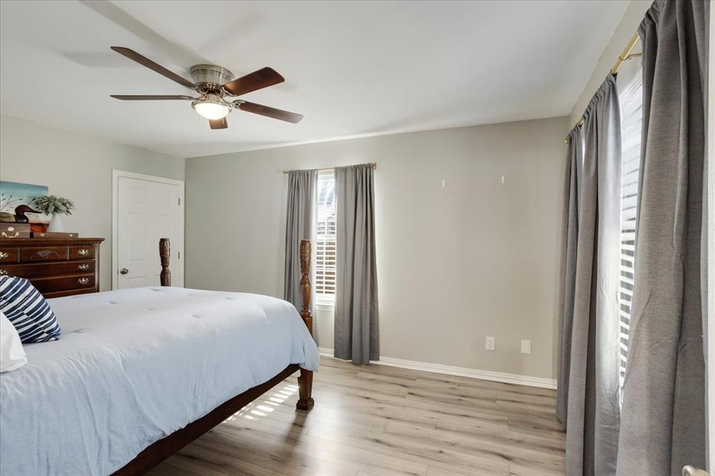 307 North Carter Street Howe, TX 75459 - Photo 19 of 31 a bedroom with a bed and a mirror