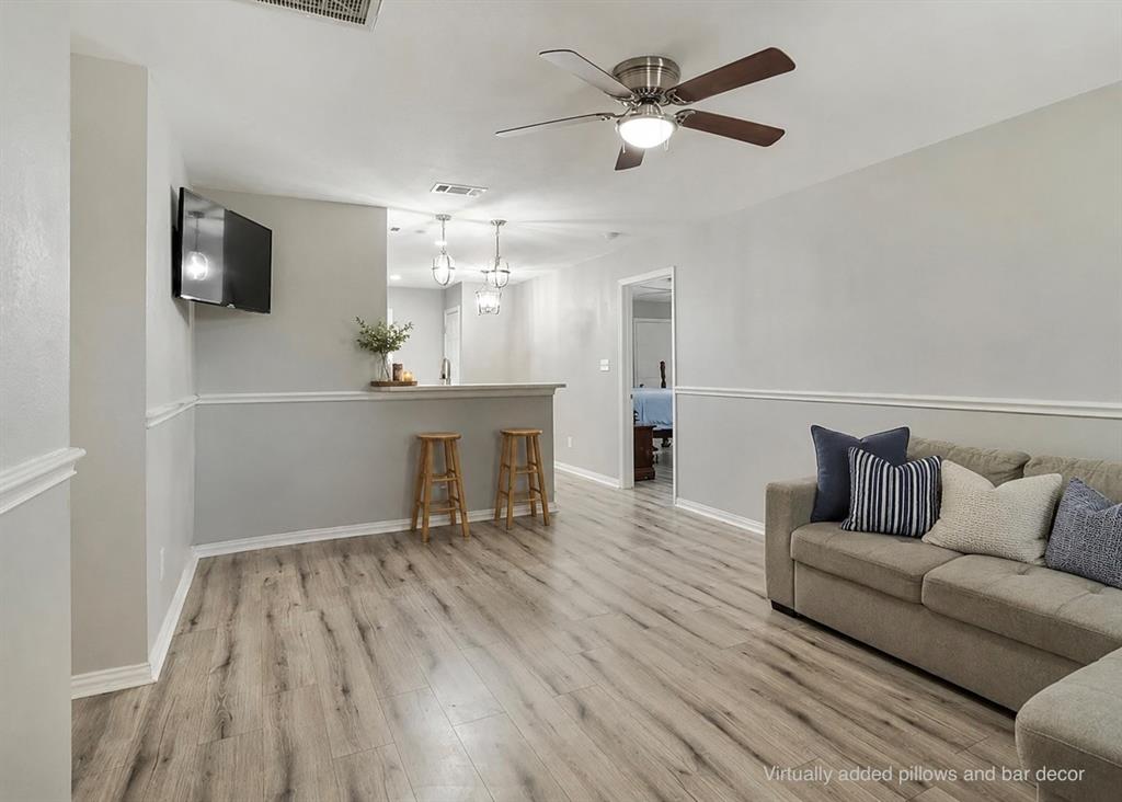 307 North Carter Street Howe, TX 75459 - Photo 2 of 31 a living room with furniture and a flat screen tv