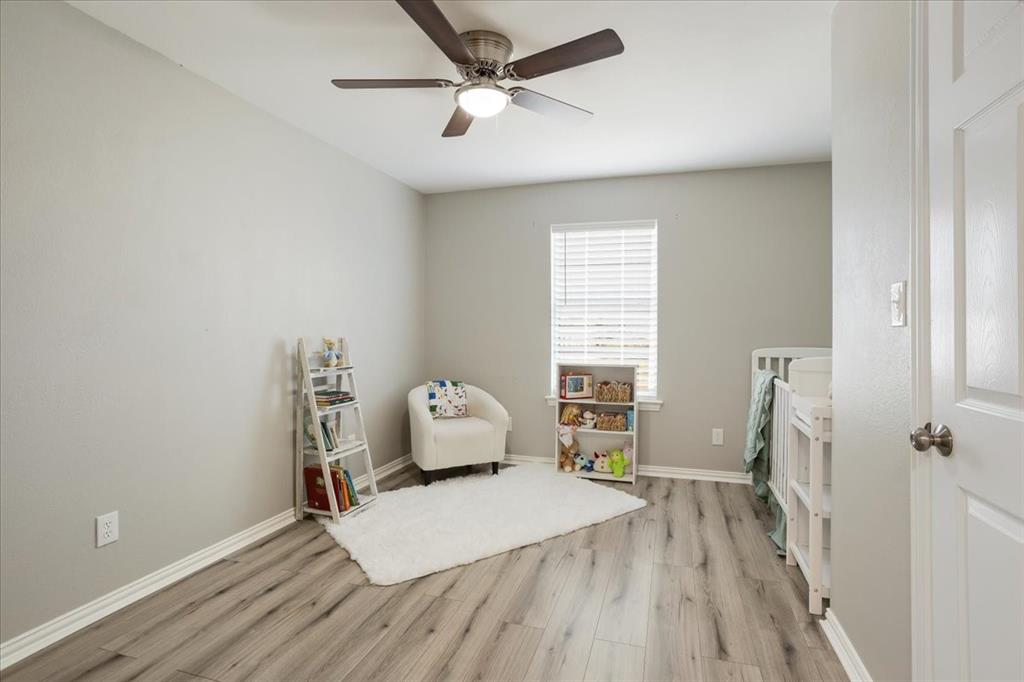 307 North Carter Street Howe, TX 75459 - Photo 23 of 31 a bedroom with a bed and a window