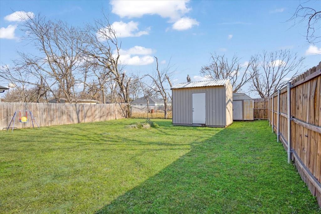 307 North Carter Street Howe, TX 75459 - Photo 27 of 31 a view of a backyard with a garden