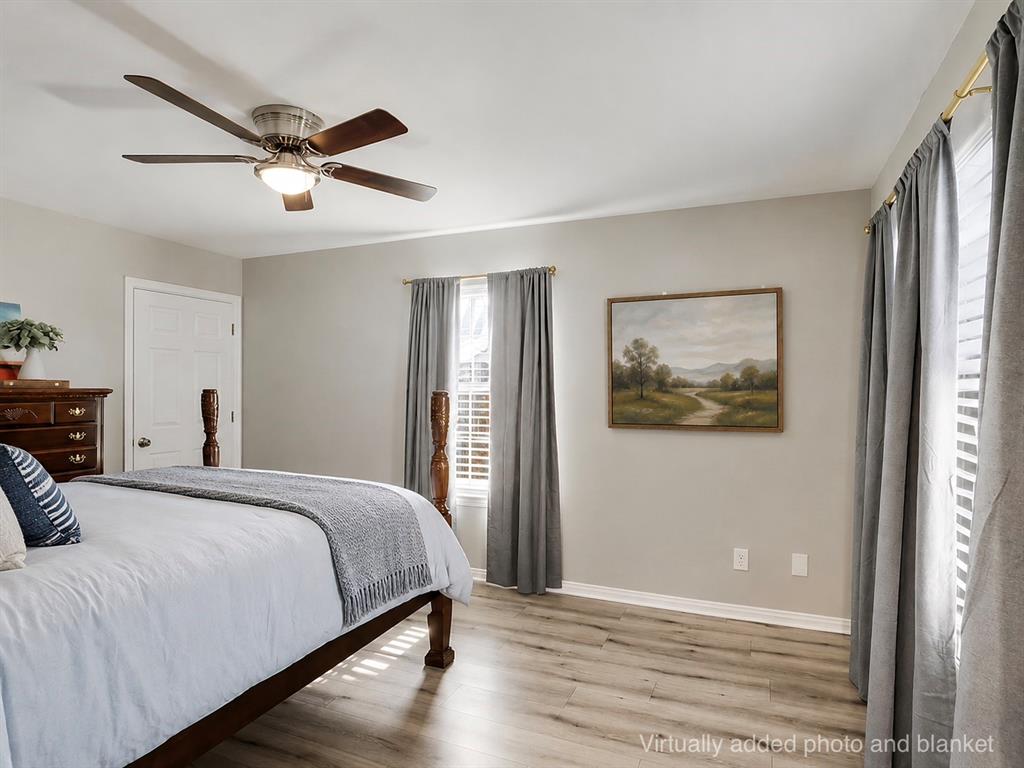 307 North Carter Street Howe, TX 75459 - Photo 4 of 31 a bedroom with a bed and a painting on the wall