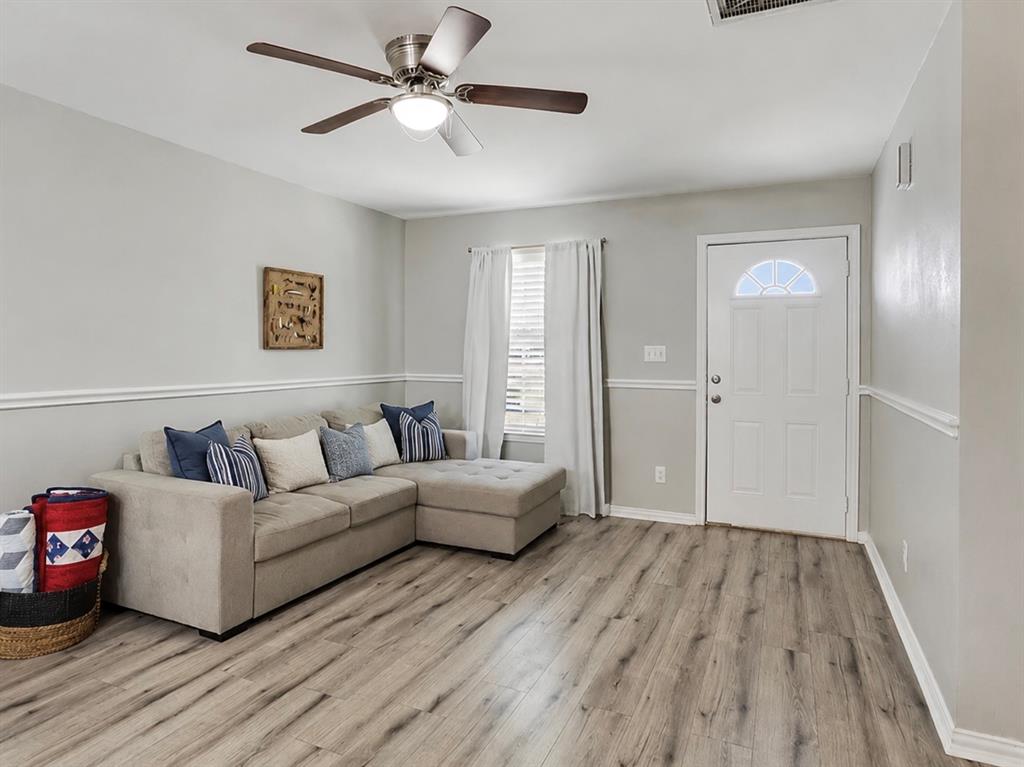 307 North Carter Street Howe, TX 75459 - Photo 6 of 31 a living room with furniture and a wooden floor