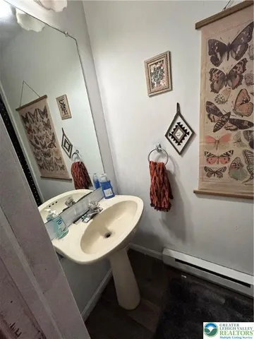 a bathroom with a sink mirror and vanity