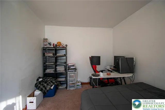 a room with furniture and gym equipment