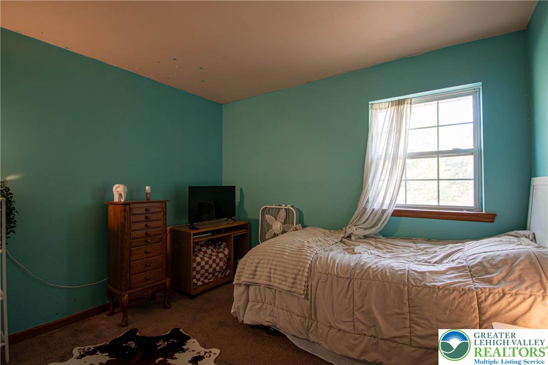 160 Grassy Road Kunkletown, PA 18058 - Photo 26 of 44 a bedroom with a bed and a television