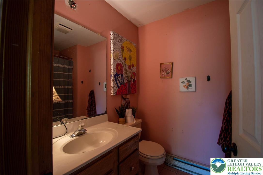 160 Grassy Road Kunkletown, PA 18058 - Photo 27 of 44 a bathroom with a sink toilet and mirror