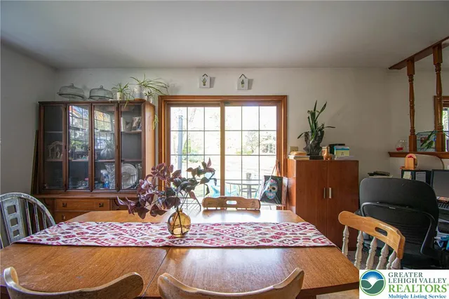 a view of a livingroom with furniture and a window