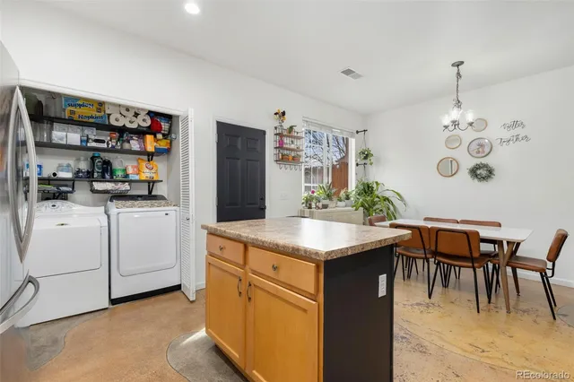 a kitchen that has a lot of cabinets in it