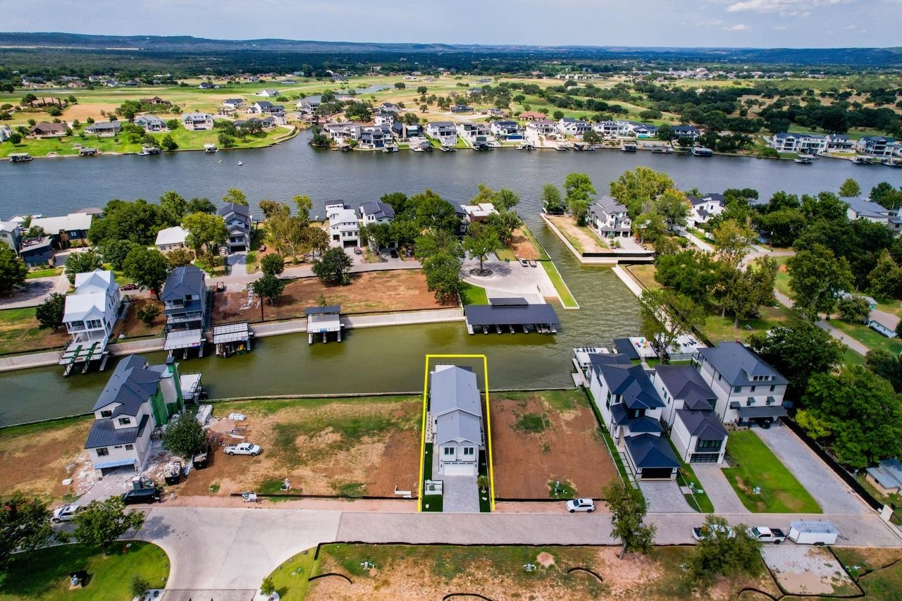 an aerial view of a house with a lake view