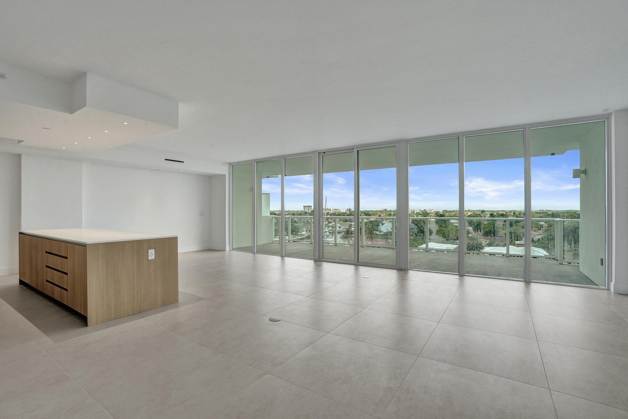 407 North Riverside Drive, Unit 602 Pompano Beach, FL 33062 - Photo 5 of 83 a view of an empty room with a sliding door