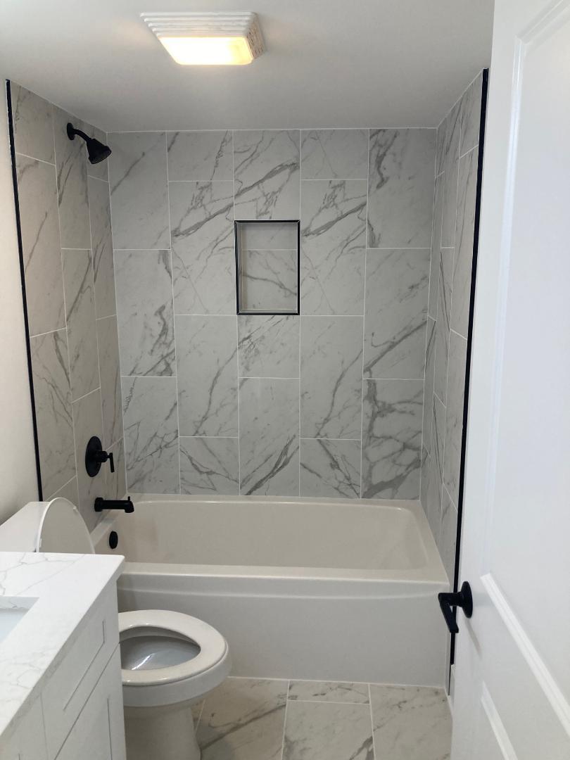 931 Saddle Ridge Drive Joliet, IL 60432 - Photo 19 of 23 a bathroom with a sink a toilet and a bathtub