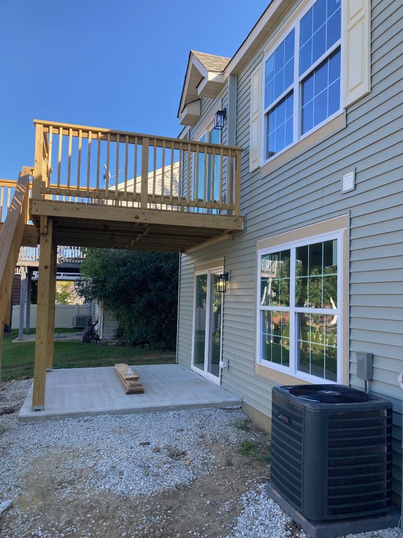 931 Saddle Ridge Drive Joliet, IL 60432 - Photo 22 of 23 a view of a house with a yard and deck