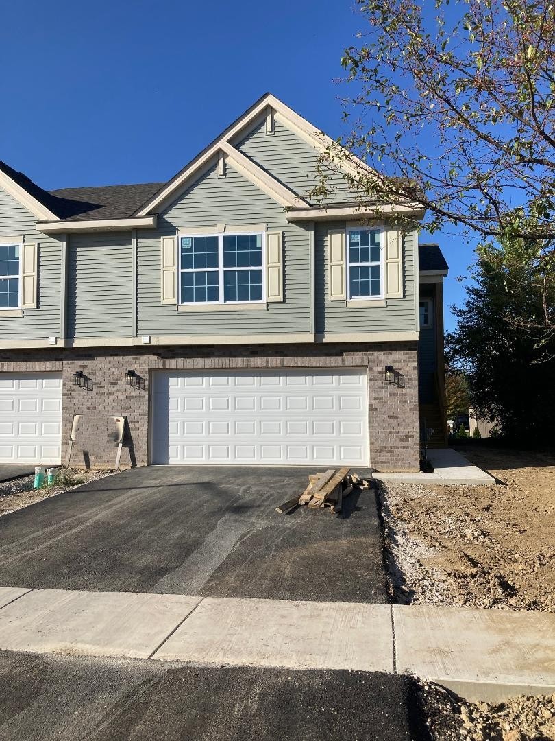 931 Saddle Ridge Drive Joliet, IL 60432 - Photo 23 of 23 a front view of a house with a yard