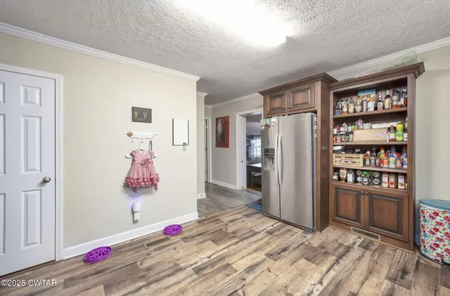 a bedroom with a bed and a book shelf