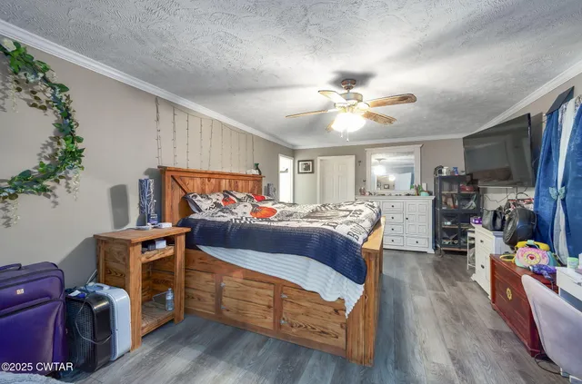 a bedroom with furniture and a chandelier