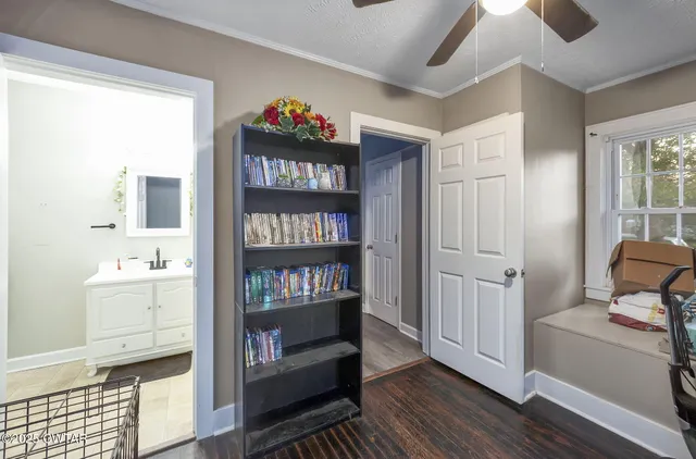 a view of room with toys and wooden floor