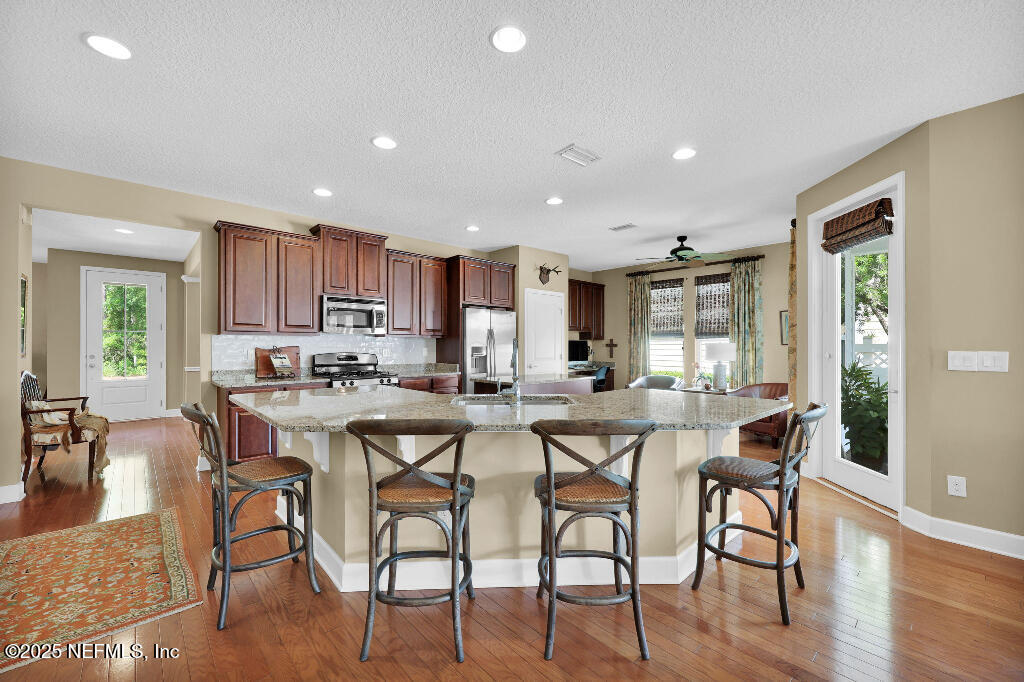 1922 North Loop Parkway St. Augustine, FL 32095 - Photo 7 of 23 a view of a dining room with furniture window and wooden floor