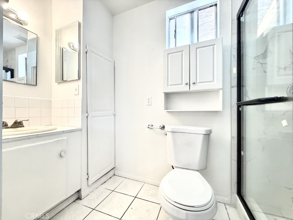 974 Grand Colton, CA 92324 - Photo 5 of 9 a white toilet sitting next to a bathroom sink