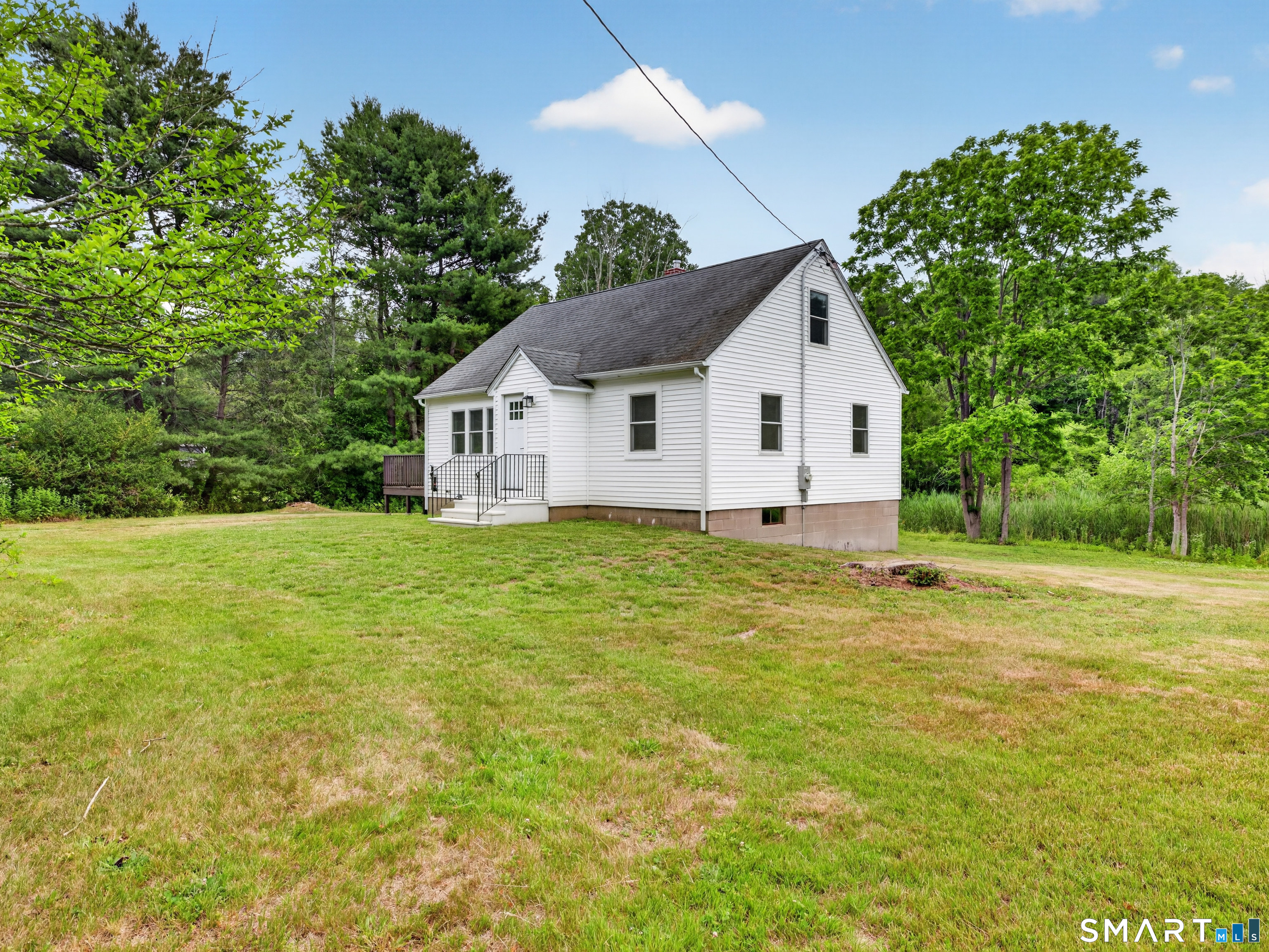 1039 N Road Groton, CT 06340 - Photo 2 of 26 a house view with a garden space