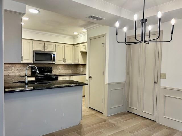 17119 Upper Bay Road Addison, TX 75001 - Photo 5 of 29 a kitchen with stainless steel appliances granite countertop a refrigerator a sink and a stove