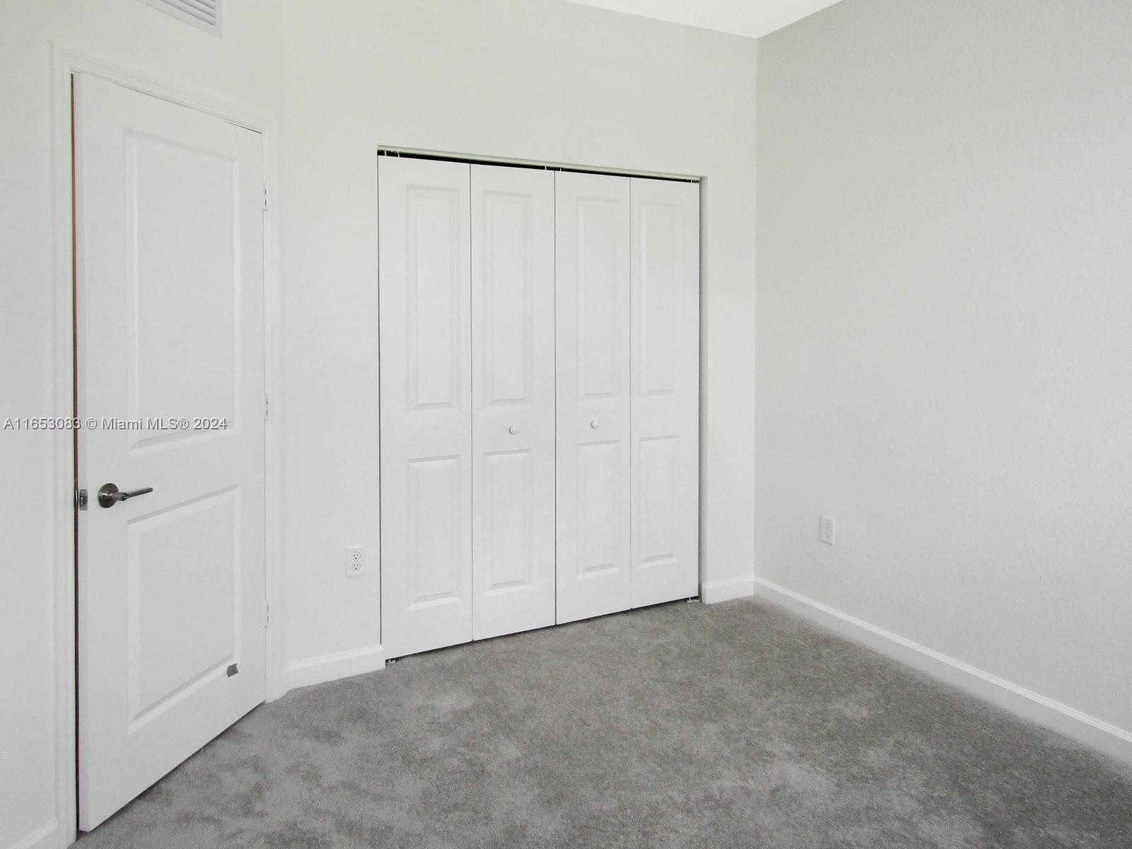 13401 Southwest 287th Street, Unit 13401 Homestead, FL 33033 - Photo 12 of 29 a view of an empty room