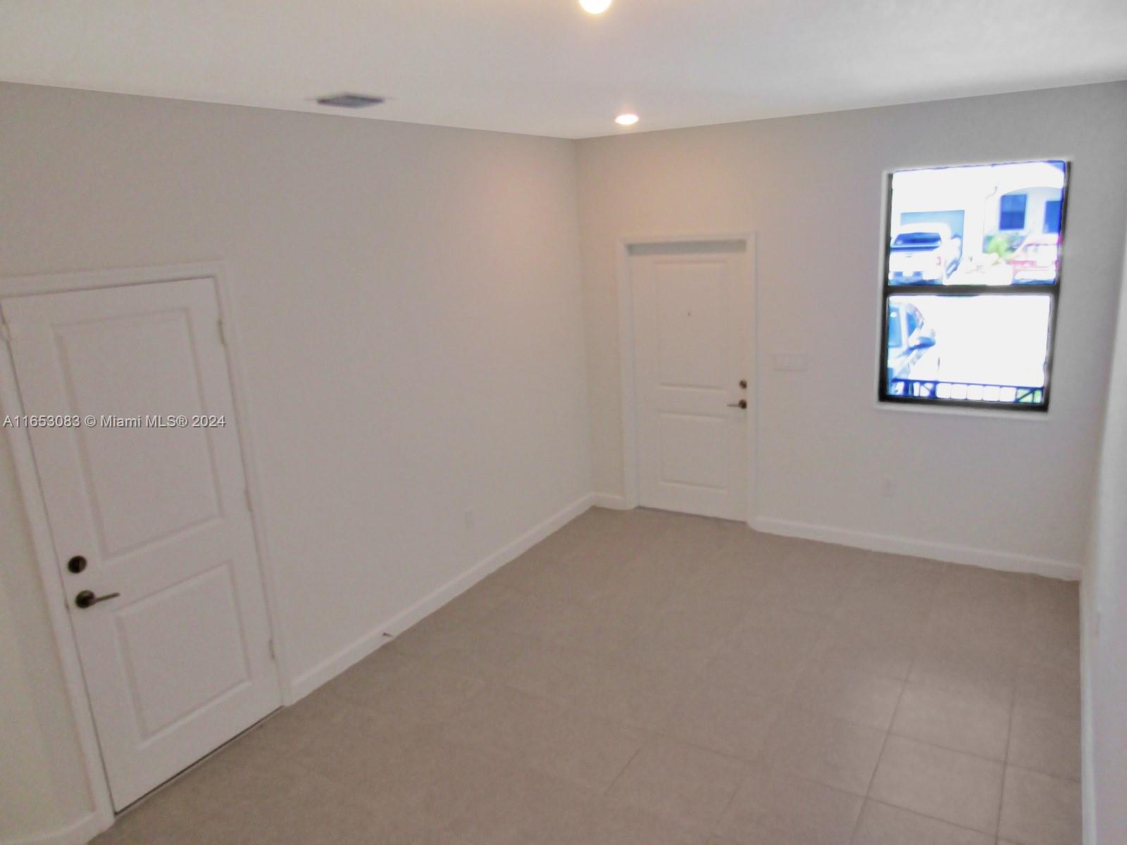 13401 Southwest 287th Street, Unit 13401 Homestead, FL 33033 - Photo 15 of 29 a view of an empty room