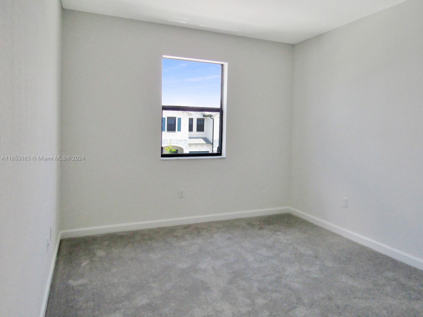 13401 Southwest 287th Street, Unit 13401 Homestead, FL 33033 - Photo 16 of 29 an empty room with windows