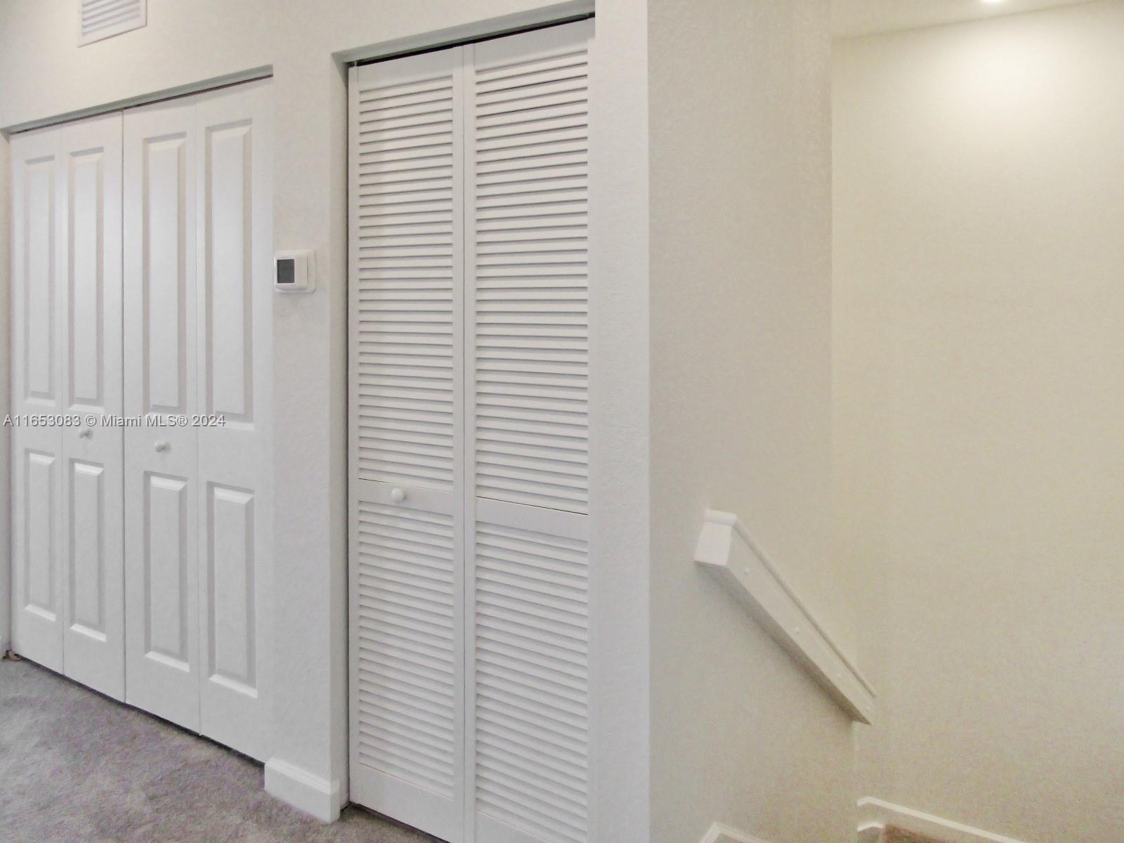 13401 Southwest 287th Street, Unit 13401 Homestead, FL 33033 - Photo 18 of 29 a view of a hallway with a white door