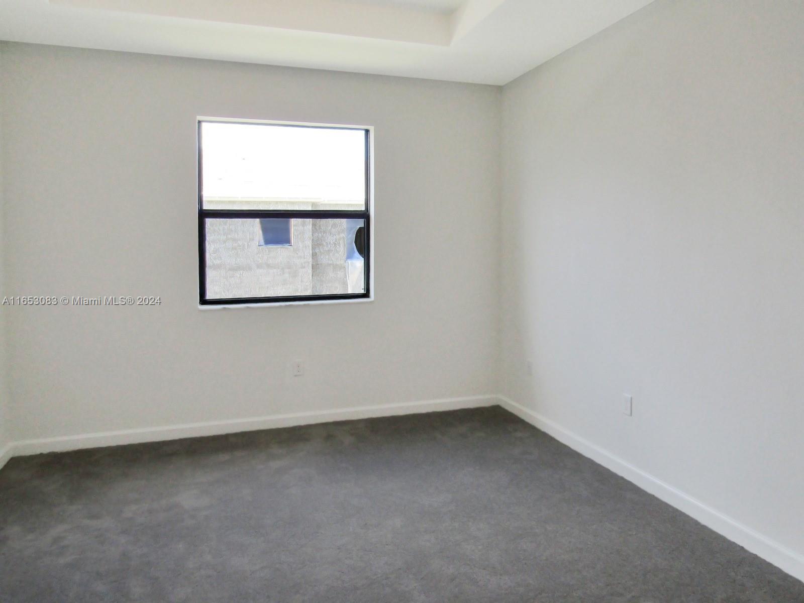 13401 Southwest 287th Street, Unit 13401 Homestead, FL 33033 - Photo 22 of 29 an empty room with a window