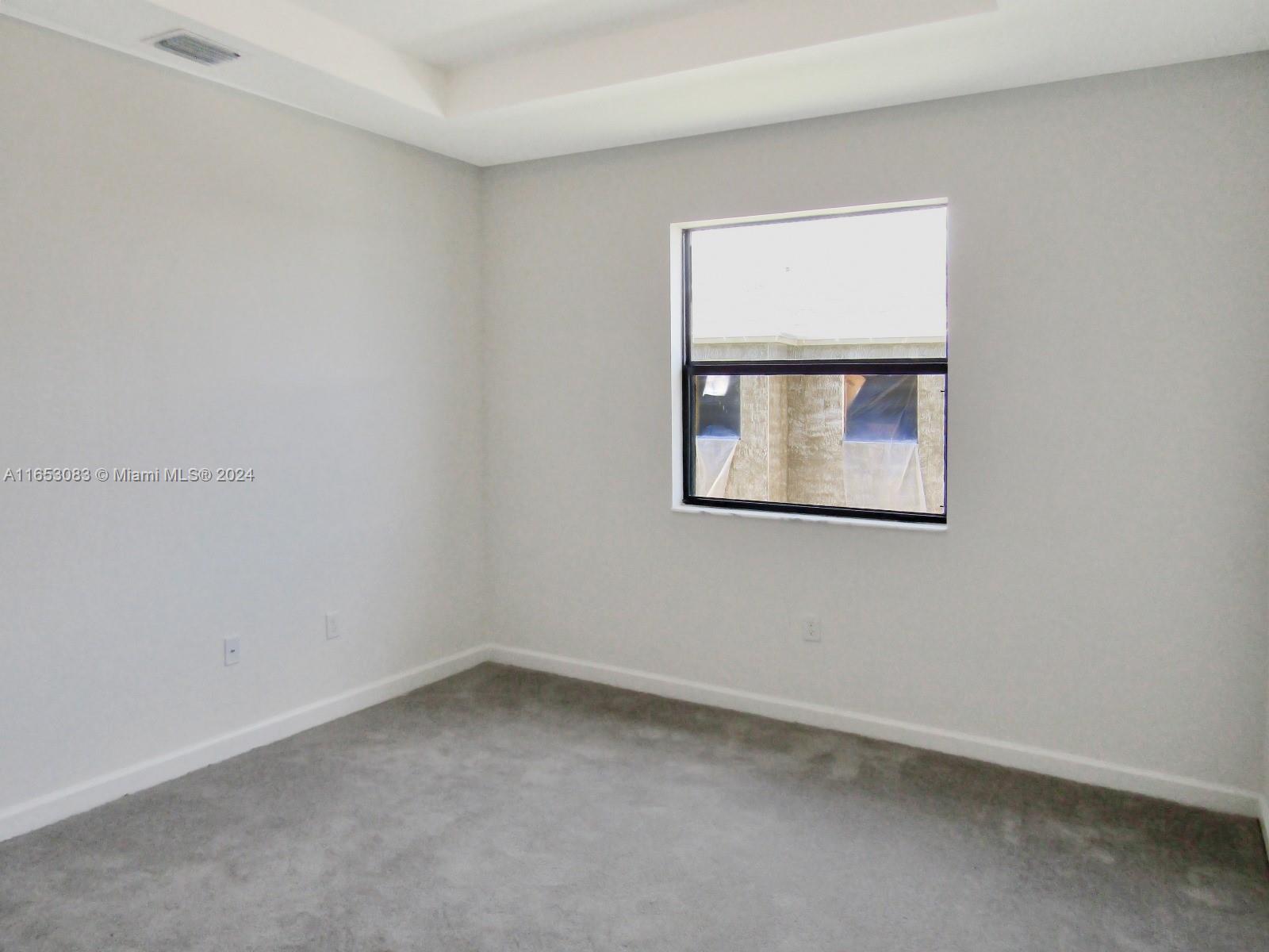 13401 Southwest 287th Street, Unit 13401 Homestead, FL 33033 - Photo 23 of 29 an empty room with a window