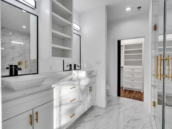 a bathroom with a sink a vanity and a mirror